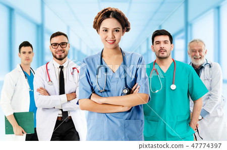 Doctor working in hospital with other doctors. 47774397