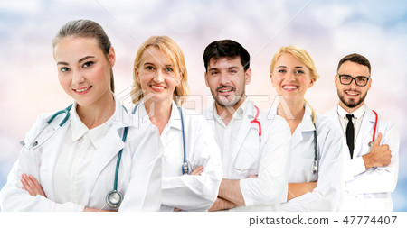 Doctor working in hospital with other doctors. 47774407
