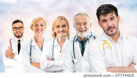 Doctor working in hospital with other doctors. 47774408