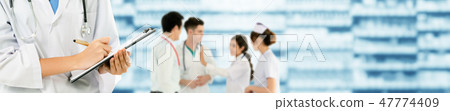 Doctor working in hospital with other doctors. Doctor working in hospital with other doctors. 47774409