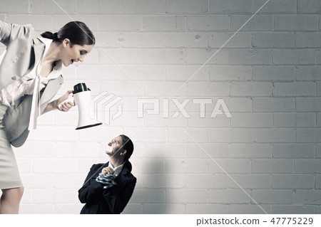 Tired woman under boos pressure 47775229