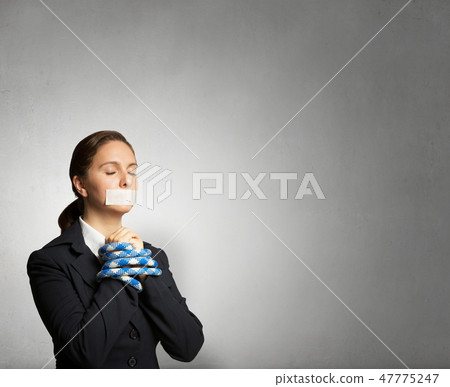 Speechless woman with tired hands Speechless woman with tired hands 47775247