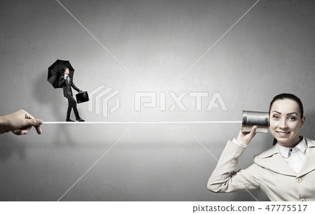 Woman using deaf phone 47775517