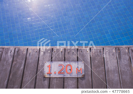 Swimming pool depth signs or markers. 47778665