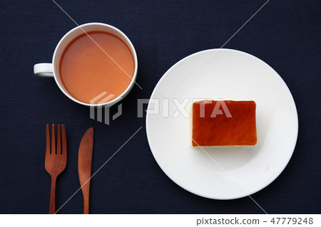 Honey orange cake black tea table on a dish 47779248