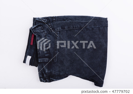 Dark blue jean fabric isolated on white background 47779702