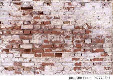 old flaked unrestored brick wall of an orthodox 47779821
