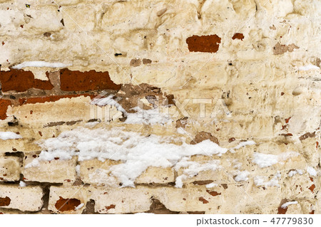 old flaked unrestored brick wall of an orthodox 47779830
