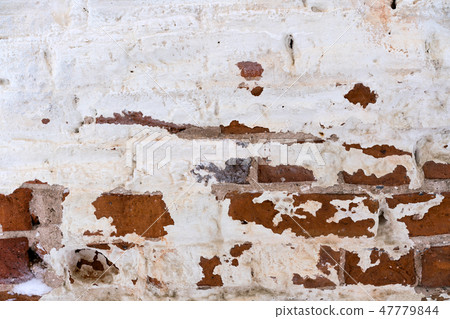old flaked unrestored brick wall of an orthodox 47779844