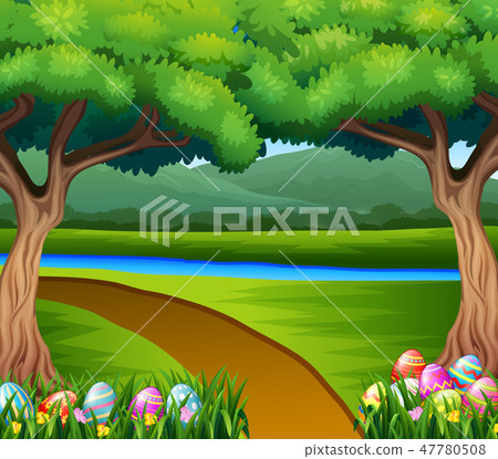 Colored easter eggs in the grass with nature Colored easter eggs in the grass with nature 47780508