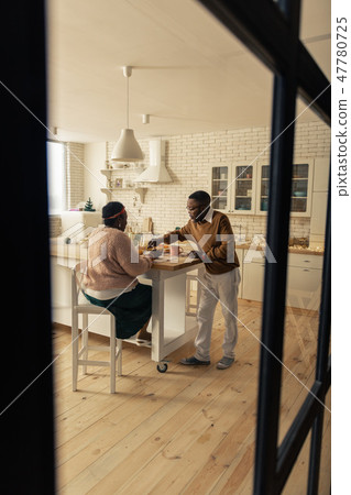 Nice married couple having breakfast in the morning 47780725