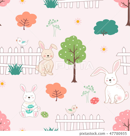 Cute rabbits with easter eggs in the garden 47780935