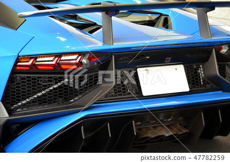 Back shot of a blue sports car [car] 47782259