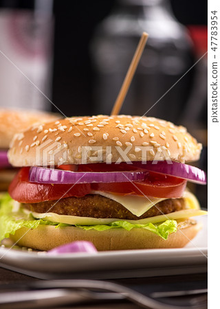 Hamburger with double cheese, red onions and tomat Hamburger with double cheese, red onions and tomat 47783954