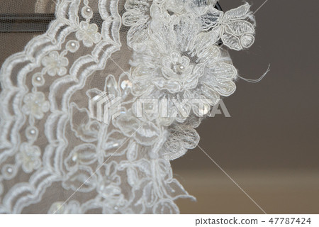 close up on ripped wedding dress 47787424