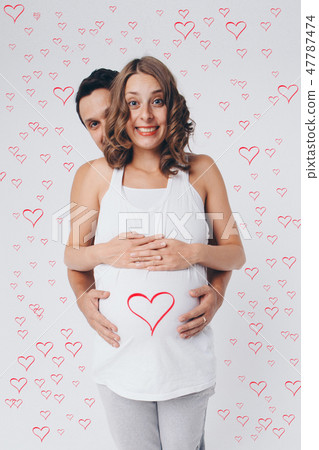 pregnant couple in love. Valentine's day heart pregnant couple in love. Valentine's day heart 47787474