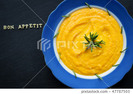 pumpkin soup in a plate 47787503