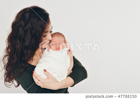 newborn baby in the arms of the mother newborn baby in the arms of the mother 47788150