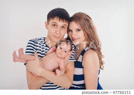 baby on the hands of parents on a white background baby on the hands of parents on a white background 47788151