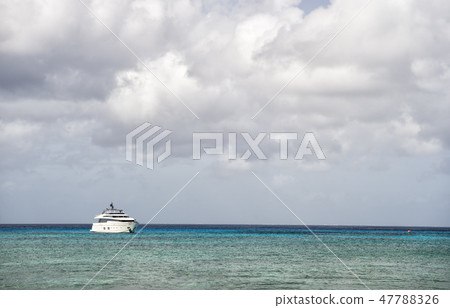 Yacht on water with cloudy sky Yacht on water with cloudy sky 47788326