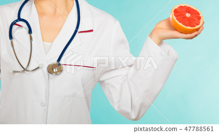 Dietitian nutritionist with grapefruit. Dietitian nutritionist with grapefruit. 47788561