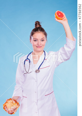 Dietitian with sweet roll bun and grapefruit. 47788562
