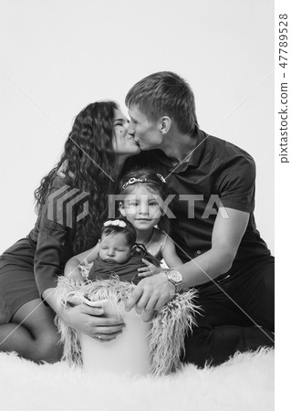 baby on the hands of parents on a white background baby on the hands of parents on a white background 47789528