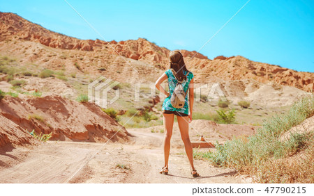 girl standing on the road with her back girl standing on the road with her back 47790215