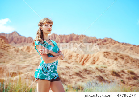 girl standing on the road with her back 47790277