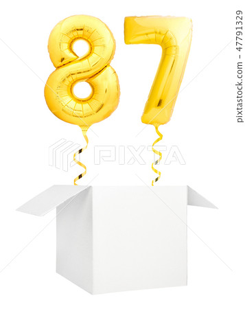 Golden number eighty seven inflatable balloon with golden ribbon flying out of blank white box Golden number eighty seven inflatable balloon with golden ribbon flying out of blank white box 47791329