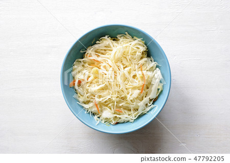 Blue bowl of fermented cabbage from above 47792205