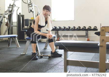 Weight training young lady Weight training young lady 47792242