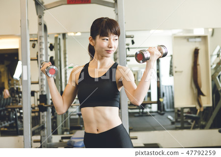 Weight training young lady Weight training young lady 47792259