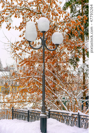 A street light covered by snow A street light covered by snow 47793264