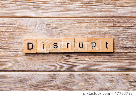 DISRUPT word written on wood block. DISRUPT word written on wood block. 47793752