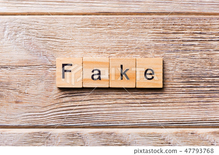 Fake word written on wood block. 47793768