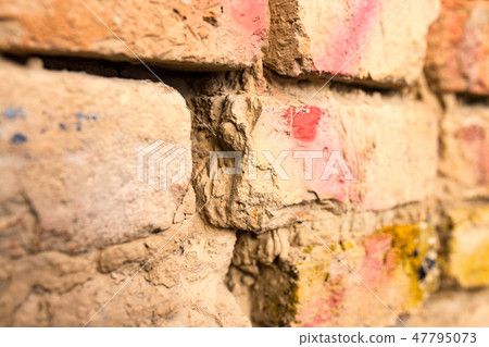 Old brick wall in the house as a background Old brick wall in the house as a background 47795073
