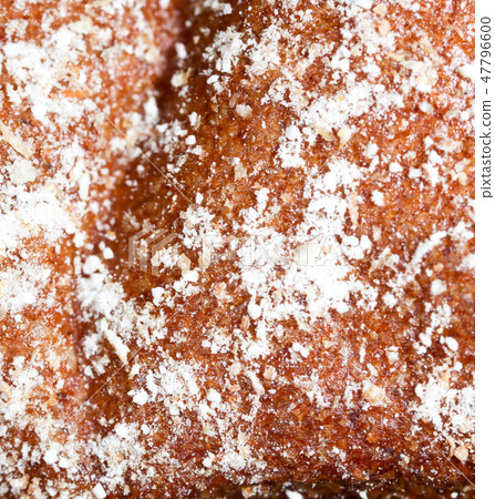 Bread with sugar powder as a background Bread with sugar powder as a background 47796600
