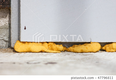 Construction foam in the wall slit as a background Construction foam in the wall slit as a background 47796811