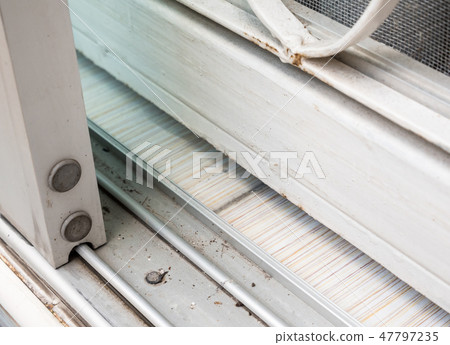 Sliding glass door on the dirty stainless rail. Sliding glass door on the dirty stainless rail. 47797235