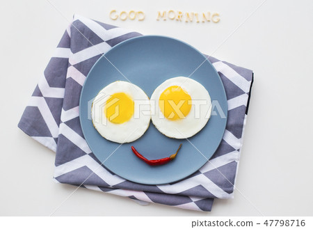two beautiful eggs on a plate two beautiful eggs on a plate 47798716