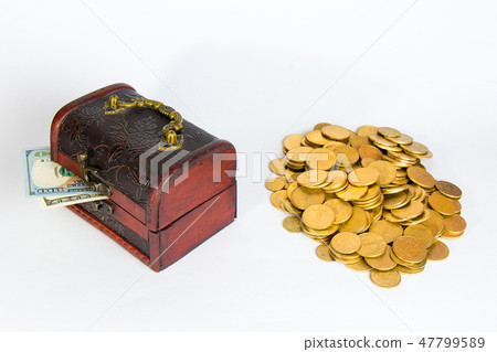 Against the dollar and gold coins on a white background. Against the dollar and gold coins on a white background. 47799589