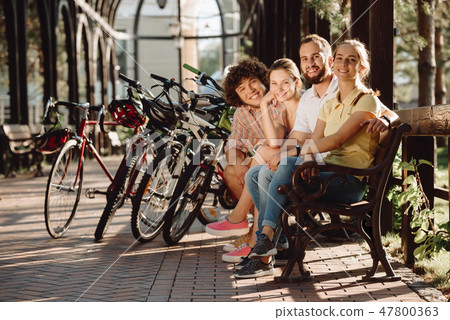 Group of smiling friends looking at camera. 47800363
