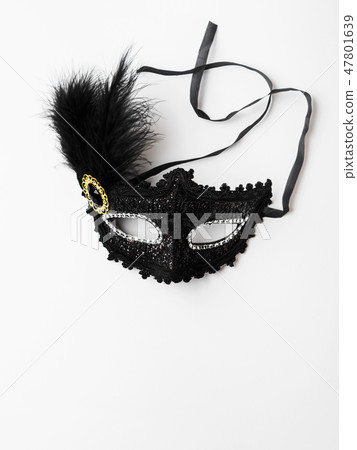 Black carnival mask on white background 47801639