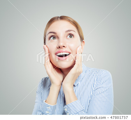 Surprised girl student or businesswoman looking up Surprised girl student or businesswoman looking up 47801737