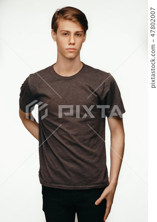 Isolated studio portrait handsome Caucasian male model with stylish hair and brown eyes, dressed in 47802007