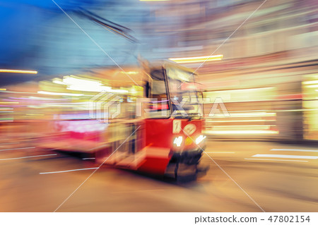 Tram on urban city street with motion blur effect 47802154