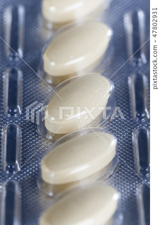 convex pills in a packaged 47802931