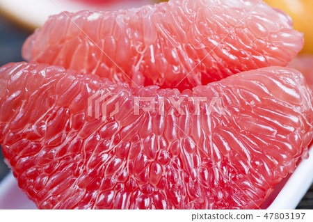peeled red grapefruit peeled red grapefruit 47803197