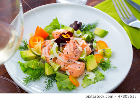 Salmon ceviche with avocado, kumquat 47805615